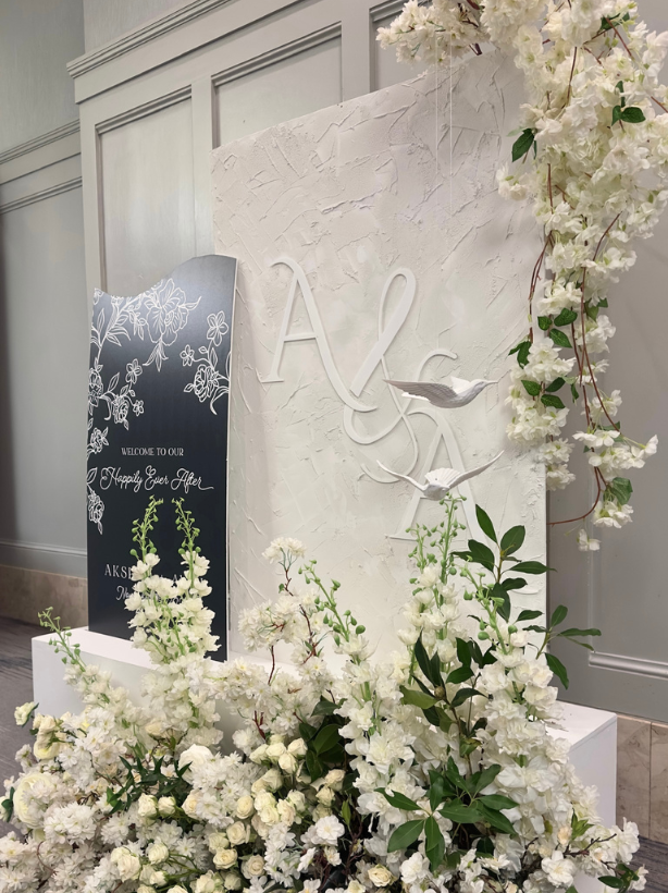 white floral welcome sign